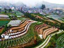 The Beauty Of The Landscape Leek And Vegetable Plantations And Architecture Of The Arrangement Of Terraced Houses In The Tourist Area Of ​​Nepal Van Java, Butuh Hamlet, Magelang, Indonesia 