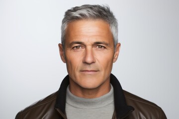 Wall Mural - Portrait of handsome mature man with grey hair in leather jacket.
