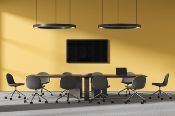 Yellow meeting room interior with table and chairs, tv screen and laptop