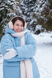 Fototapeta Koty - portrait of happy beautiful woman outside at cold winter day