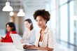 © Iryna - Happy, diverse business team in a modern office using technology, collaborating and creating a successful work environment.