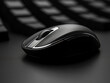 Detailed shot of a computer mouse with a monochromatic and smooth design. -