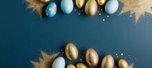 Beautiful Gold And Blue Easter Eggs With Golden Glitters On A Blue Background With Copy Space. Easter Egg Background With Copy Space.