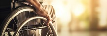 banner picture of an older man's hand on a wheelchair wheel, reflecting life with a disability