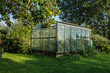 greenhouse with plants in a garden in the French village of Parfondeval