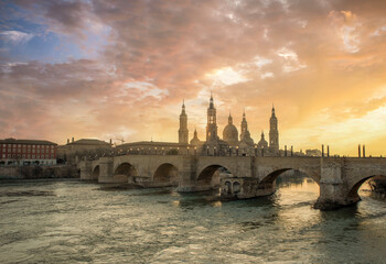 Wall Mural - spain zaragoza city architecture and landscapes colorful sunset clouds and light
