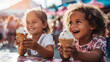 Kids enjoying ice cream at a colorful outdoor summer festival.