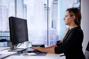 web developer coding on computer