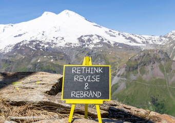 Wall Mural - Rethink revise rebrand symbol. Concept word Rethink Revise and Rebrand on beautiful blackboard. Beautiful mountain background. Business brand motivational rethink revise rebrand concept. Copy space.