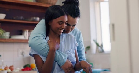 Wall Mural - Couple, kiss and cooking in embrace with love or care in marriage, partnership or home. Happy, man and woman hug with kindness, support or trust together in interracial relationship in kitchen