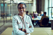 © Marko Geber - Smiling portrait confident happy senior businesswoman in office