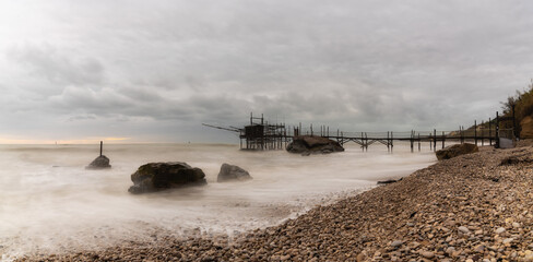 Poster - Trabocco Punto Le Morge on a rainy day under a cloudy sky long exposure