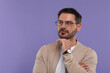 © New Africa - Portrait of man in stylish glasses on violet background. Space for text