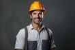 Smiling Construction Worker in Hard Hat Standing Indoors