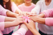 close up of female Hands with pink ribbon. World cancer day
