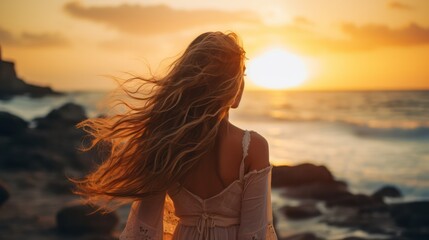 Wall Mural - Silhouette of a lady walking on the beach