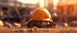 construction safety equipment helmet on construction site orange sun background