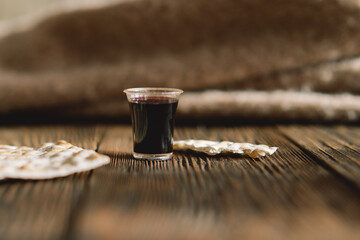 Wall Mural - Communion. Religious tradition of breaking bread. Bread and wine as a sign of memory of Christ's sacrifice.