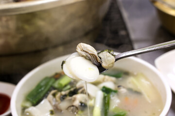 Korean food. oyster rice cake soup