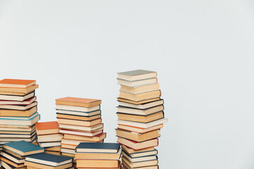 Wall Mural - Stacks of educational books in university library on white background