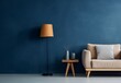Dark blue wall background of modern living room with beige color single sofa, table, and a lamp. Modern home interior design of modern room.