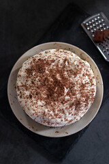 Wall Mural - Classic banoffee pie a simple cookie crust is filled with thick caramel, slices of fresh banana and whipped cream on top. 