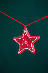 Wall Mural - red christmas star on green background