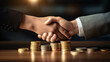 Two people shake hands making a financial deal
