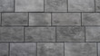 Close-up grey Clinker tiles wallpaper imitation brick for finishing works. Material for covering the facade and walls. Modern clinker tile imitating brickwork.