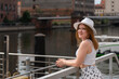 © Андрей Трубицын - girl in a white hat on the background of the city of Gdansk Poland Europe