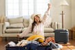 © Art_Photo - Portrait of backpacker beauty asian traveler woman packing prepare stuff and outfit clothes in suitcases travel bag luggage for summer, holiday, weekend, tourist, journey, vacation trip at home.travel