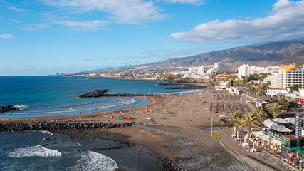 Aerial photo from drone to de Tenerife and beachs Adeje Playa de las Americas, Playa Honda,Playa de Troya, Playa de El Bobo.In the background Tenerife at sunset. Tenerife, Canary islands, Spain