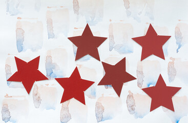 Sticker - collection of red stars on paper with watercolor stains