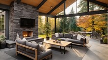 New Modern Home Features A Backyard With Covered Patio Accented With Stone Fireplace, Vaulted Ceiling With Skylights And Furnished With Gray Wicker Sofa Placed On Concrete Floor.