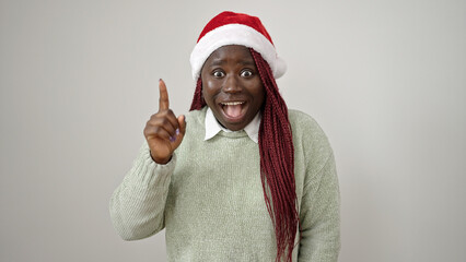 Sticker - African woman with braided hair smiling doing idea gesture with finger over white background