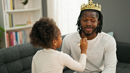 Sticker - African american father and daughter wearing king crown playing with makeup at home