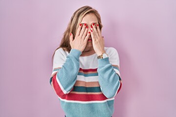 Canvas Print - Young blonde woman standing over pink background rubbing eyes for fatigue and headache, sleepy and tired expression. vision problem