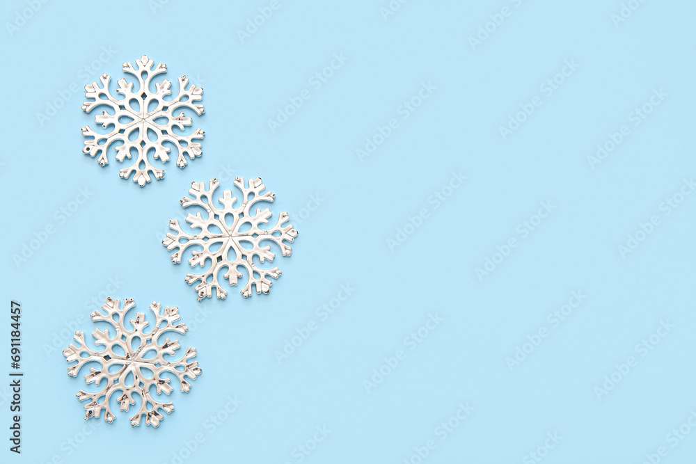 Christmas decorative snowflakes on blue background