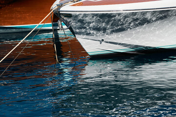 Wall Mural - Sun glare on glossy board boats, azure water, tranquillity in port Hercules, bows of moored boats at sunny day, megayachts, Monaco, Monte-Carlo