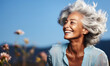 © Bartek - Radiant senior woman with silver hair, beaming with joy, wearing a light blue blouse with lace details, against a soft blue backdrop
