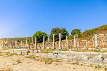 Wall Mural - Travelers to the town of Perge in Turkey have the opportunity to wander its magnificent colonnaded streets, marvel at detailed mosaics, and be captivated by its monumental structures.