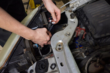 Wall Mural - Car headlight in repair on the desktop