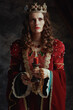 © Alliance - medieval queen in red dress with candle and crown