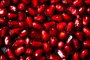 Wall Mural - pomegranate seeds on the dark background