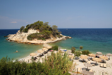 Wall Mural - Sunrise beach  with crystal clear water in the traditional Greek fishing village of Kokarri on the island of  Samos