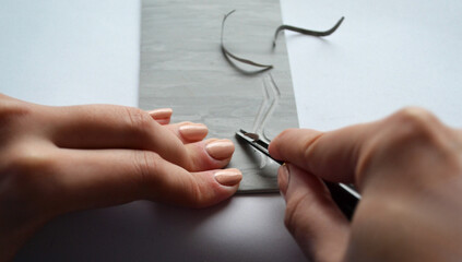 Artist's hands - linocut. Creation of handmade works. Art and design.