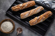 baked baguettes on a tray in the kitchen