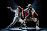 Adult male and female hip-hop couples dancing at practice, smiling being happy. Youth culture, movement, style and fashion, action, breakdance.