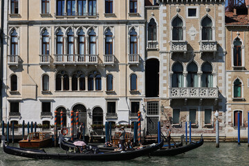 Wall Mural -  Tourists during a Gondola cruise on the Grand Canal in Venice. Italy