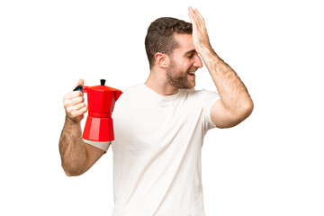 Poster - Young handsome blonde man holding coffee pot over isolated chroma key background has realized something and intending the solution